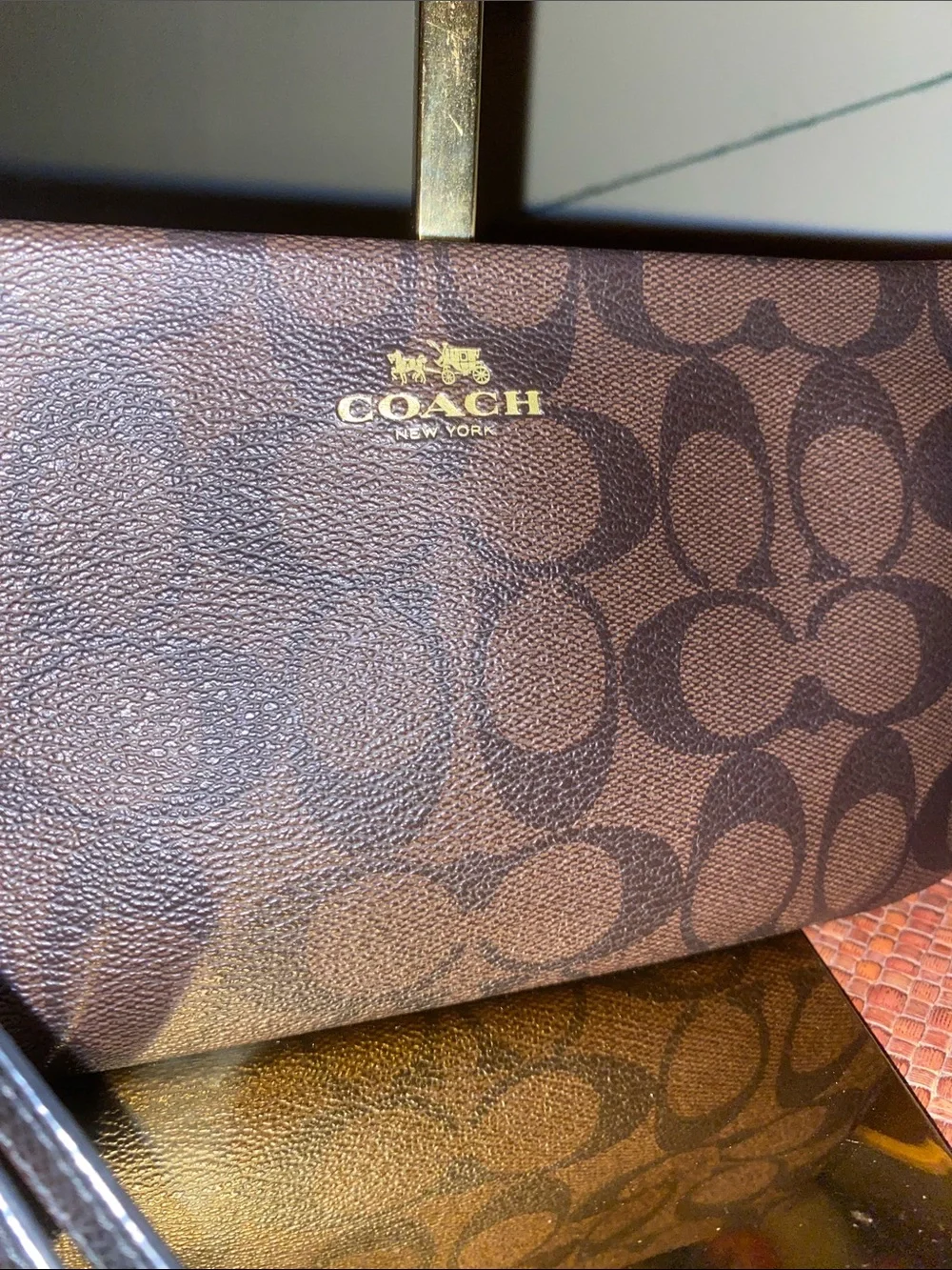 Coach Large Corner Zip Wristlet with signature brown canvas monogram
